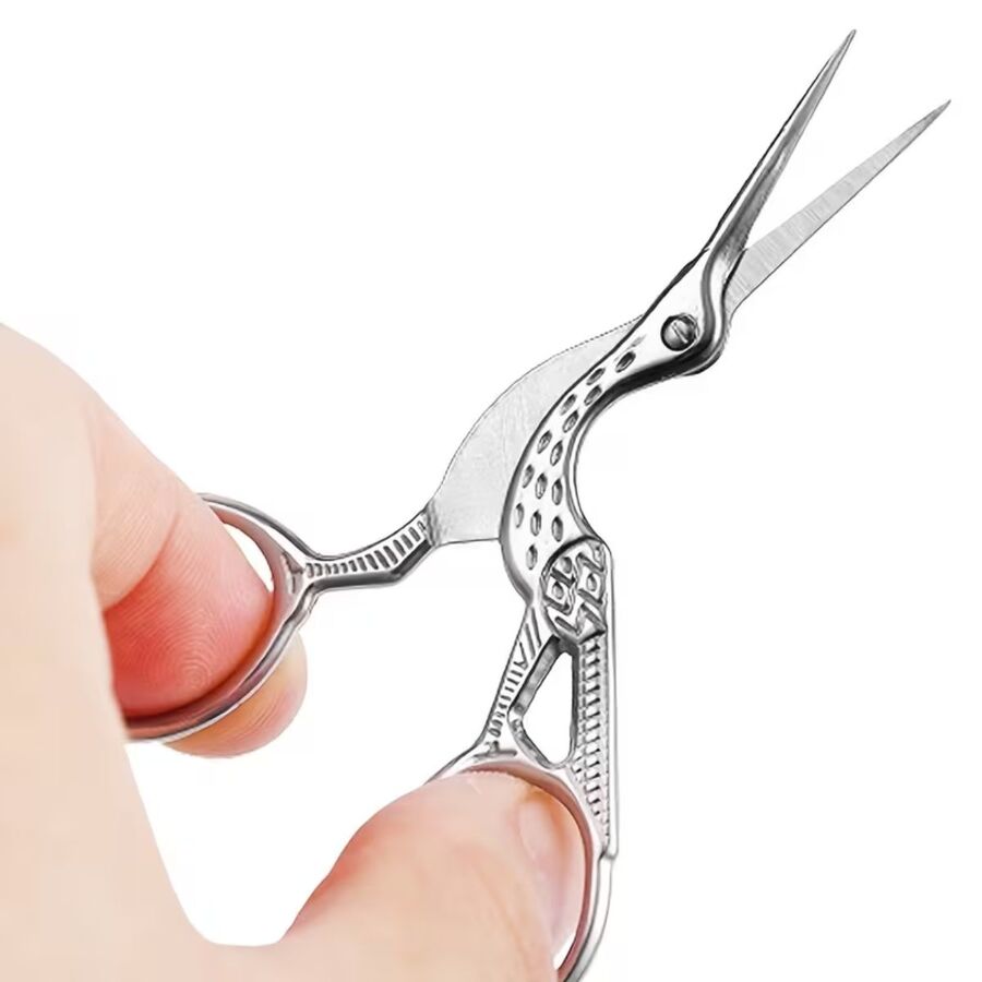 Tijera Ave Cigueña Plateada